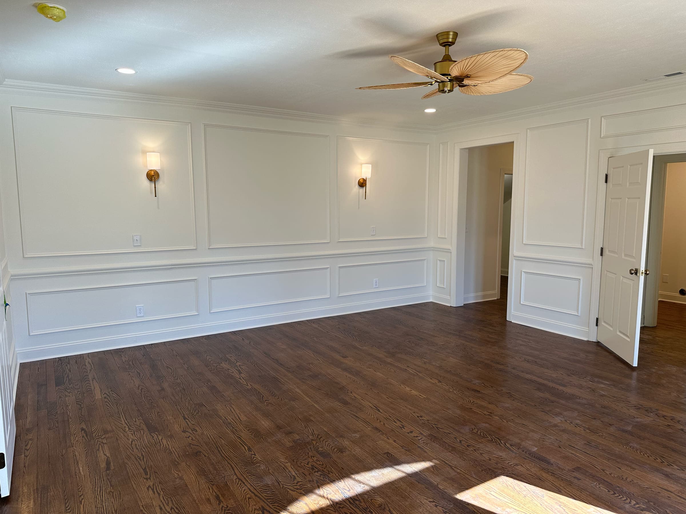 Master bedroom in the Rocky Mount custom remodel in Franklin County, with a wall moved, the floors patched in and wainscoting throughout